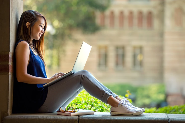 High school student studying online at home